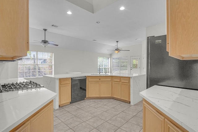 kitchen featuring black dishwasher, visible vents, light brown cabinetry, a sink, and recessed lighting