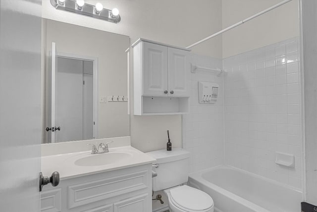 bathroom featuring shower / bathing tub combination, vanity, and toilet