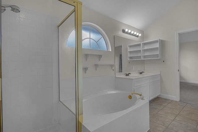 full bathroom featuring baseboards, tiled shower, lofted ceiling, a garden tub, and a sink