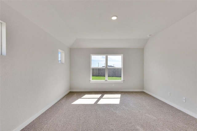 208 Seattle Slew Dr, Jarrell, TX 76537 - carpeted spare room featuring baseboards and vaulted ceiling