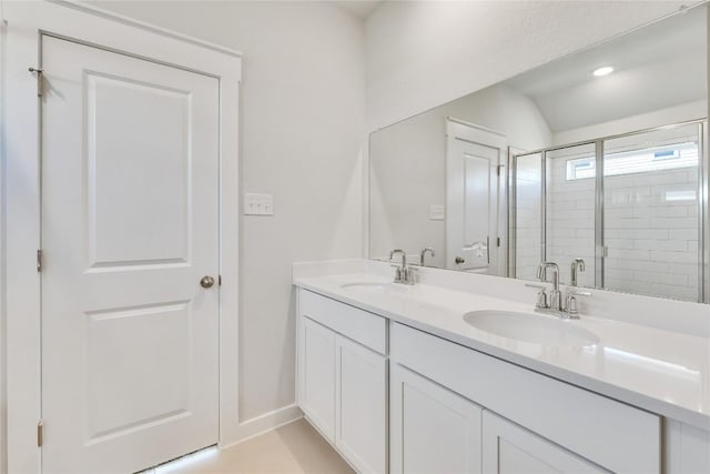 208 Seattle Slew Dr, Jarrell, TX 76537 - full bath with double vanity, a shower stall, and baseboards