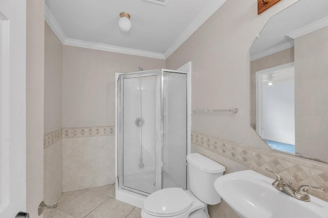 15009 Mossycup Ln, Austin, TX 78724 - full bathroom featuring a sink, toilet, a shower stall, tile walls, and ornamental molding