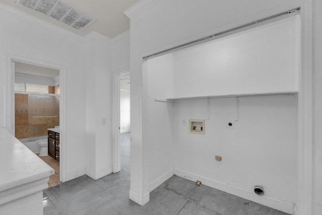 15009 Mossycup Ln, Austin, TX 78724 - washroom with electric dryer hookup, washer hookup, hookup for a gas dryer, and baseboards