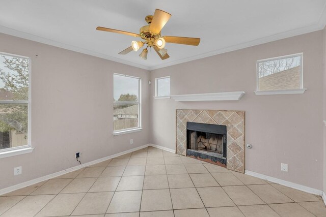 15009 Mossycup Ln, Austin, TX 78724 - unfurnished living room with a tile fireplace, crown molding, a ceiling fan, baseboards, and tile patterned flooring