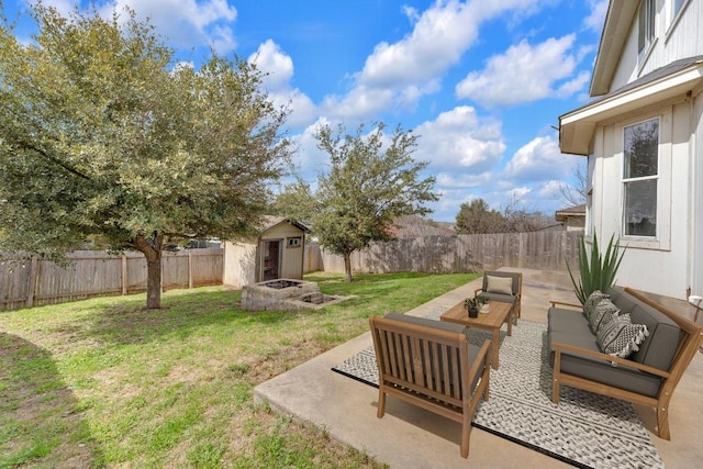 view of yard featuring a fenced backyard, a patio area, an outdoor living space, and an outdoor structure