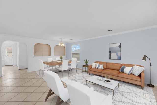 15009 Mossycup Ln, Austin, TX 78724 - living area featuring arched walkways, light tile patterned floors, crown molding, a chandelier, and baseboards