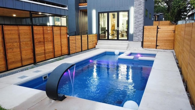 view of swimming pool featuring a fenced backyard and a fenced in pool