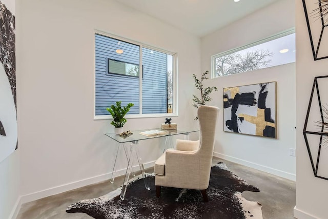 office area with concrete floors and baseboards