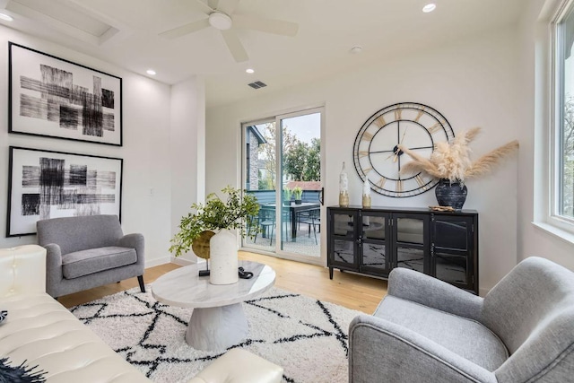 living room with visible vents, baseboards, a ceiling fan, wood finished floors, and recessed lighting