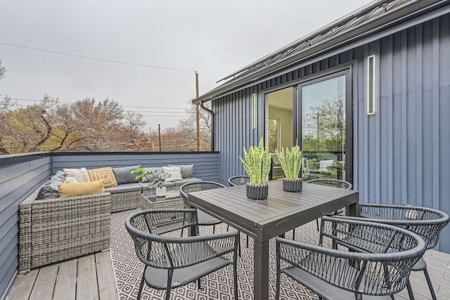 wooden terrace featuring an outdoor hangout area