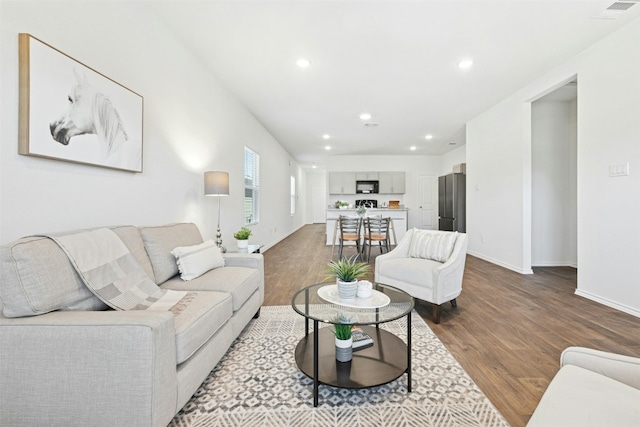 187 Dorchester Dr, Kyle, TX 78640 - living room with dark wood-style flooring and recessed lighting