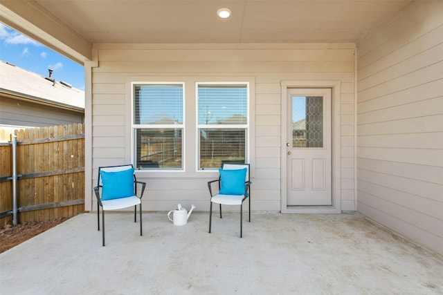 view of patio featuring fence