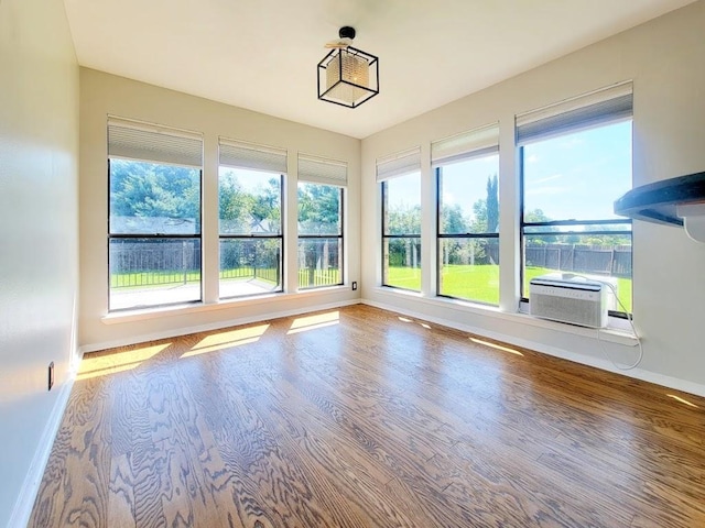 unfurnished sunroom featuring cooling unit