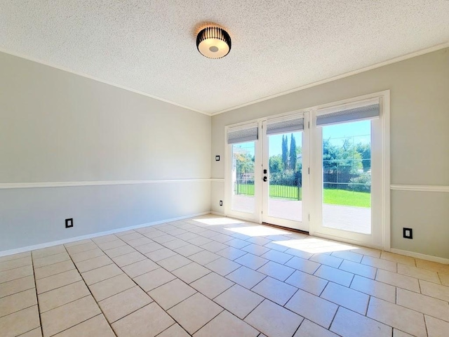 spare room featuring crown molding, a textured ceiling, baseboards, and light tile patterned floors