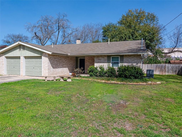 single story home with an attached garage, brick siding, a chimney, and a front yard