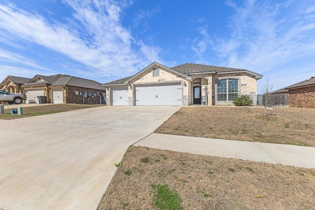 view of front facade with concrete driveway, stone siding, an attached garage, and fence