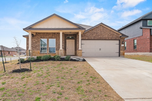 view of front of house with a garage, concrete driveway, brick siding, and board and batten siding