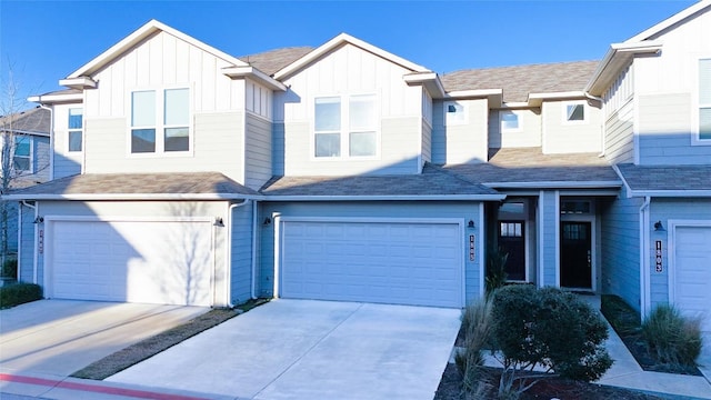 1805 Roseburg Dr, Austin, TX 78754 - multi unit property featuring board and batten siding, a garage, concrete driveway, and roof with shingles
