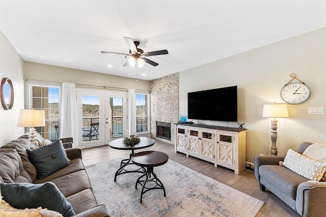 3404 American Dr Unit 3221, Lago Vista, TX 78645 - living area featuring ceiling fan, french doors, a fireplace, recessed lighting, and wood finished floors