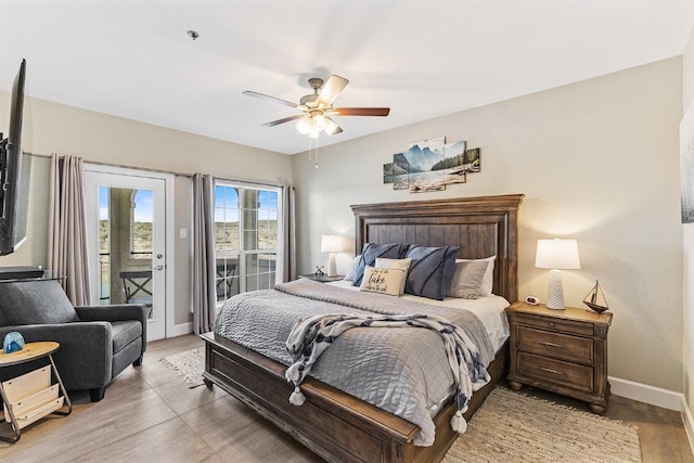 3404 American Dr Unit 3221, Lago Vista, TX 78645 - bedroom featuring access to exterior, baseboards, light wood finished floors, and a ceiling fan