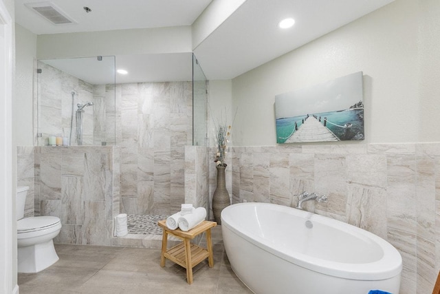 3404 American Dr Unit 3221, Lago Vista, TX 78645 - full bath featuring tile walls, a walk in shower, toilet, a soaking tub, and wood finished floors