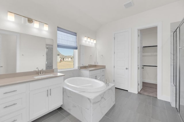 full bathroom with two vanities, visible vents, a sink, and a shower stall