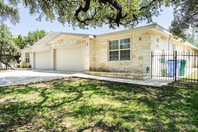 ranch-style house with driveway, stone siding, an attached garage, fence, and a front yard