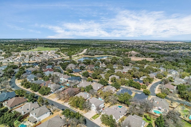 birds eye view of property featuring a residential view and a water view