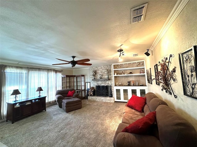 carpeted living room with a textured wall, visible vents, crown molding, and a textured ceiling