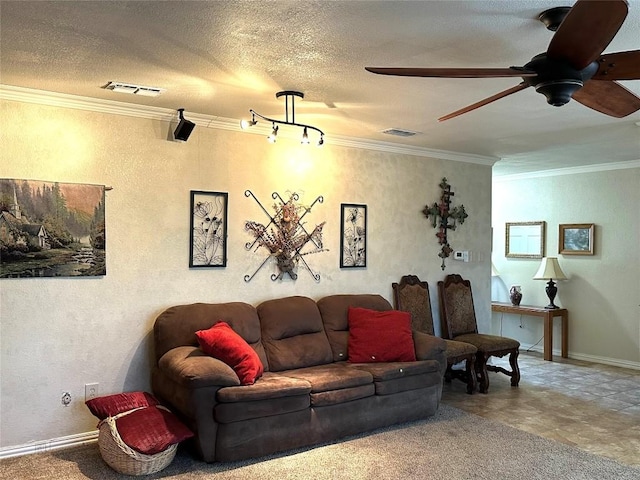 living room with a textured ceiling, visible vents, and crown molding