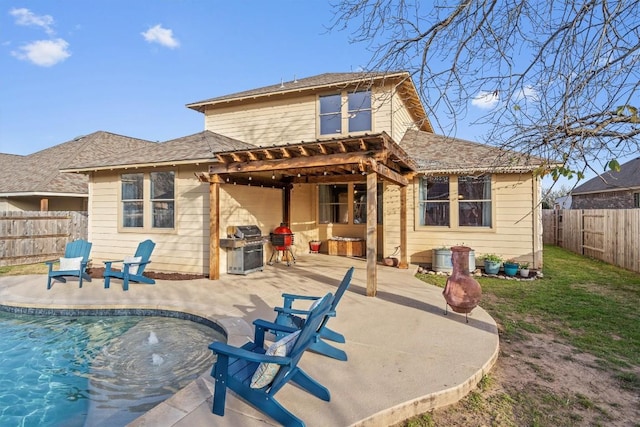 back of house with a fenced in pool, a yard, a patio, a shingled roof, and a fenced backyard