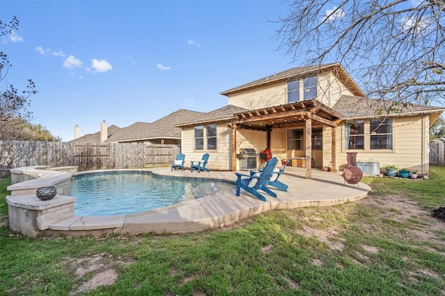 rear view of property featuring a fenced in pool, a patio area, a lawn, and a fenced backyard