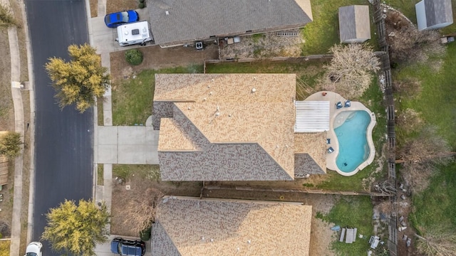 aerial view of property's location with a pool area
