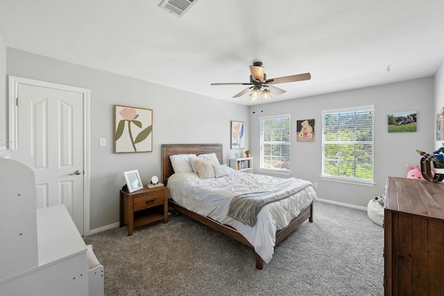 bedroom featuring carpet floors, baseboards, visible vents, and a ceiling fan