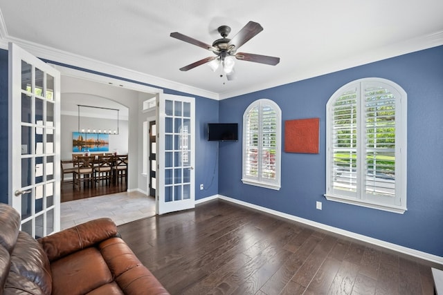 unfurnished room with a ceiling fan, french doors, baseboards, and hardwood / wood-style floors