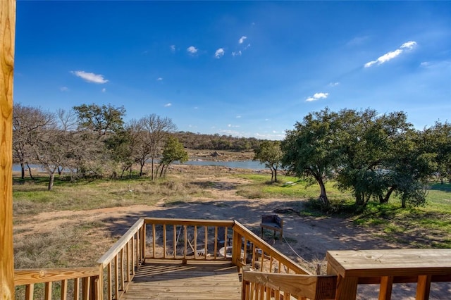 wooden deck with a water view