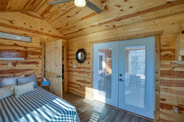 bedroom with french doors, wood ceiling, vaulted ceiling, wooden walls, and wood finished floors