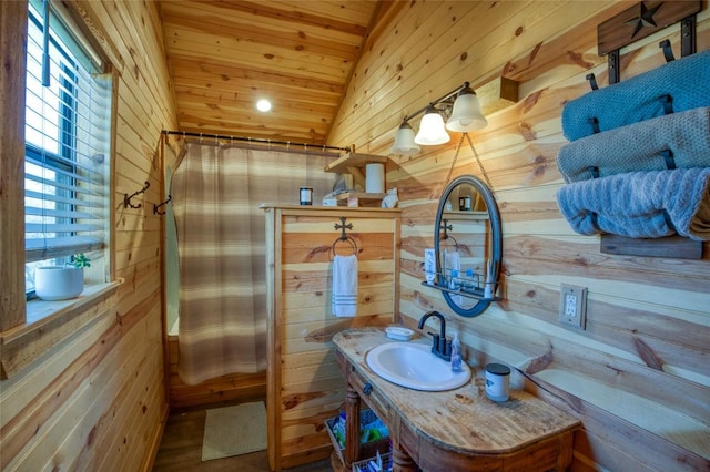 full bath with a shower with shower curtain, wood ceiling, vaulted ceiling, wood walls, and vanity