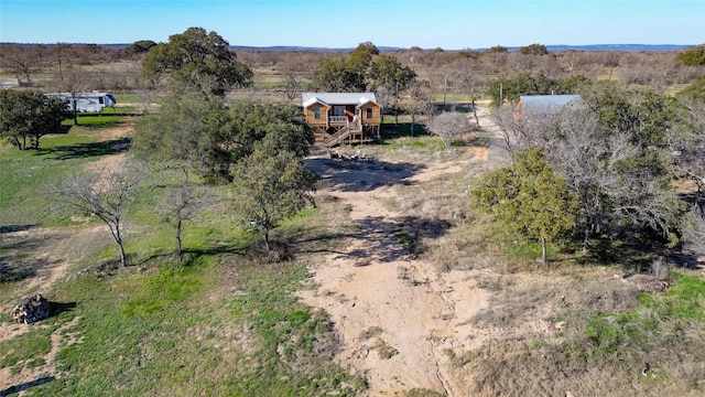 birds eye view of property featuring a rural view