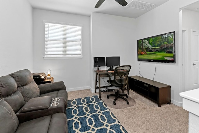 carpeted home office with baseboards, visible vents, and ceiling fan