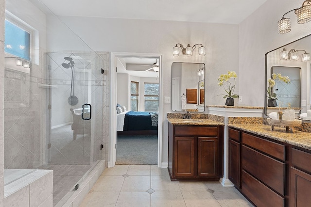 full bathroom featuring ceiling fan, a shower stall, ensuite bath, vanity, and tile patterned floors