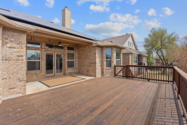 deck with french doors and ceiling fan