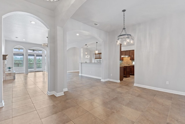 interior space with light tile patterned flooring, recessed lighting, visible vents, and baseboards