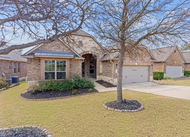 view of front of property with a front yard, brick siding, and an attached garage