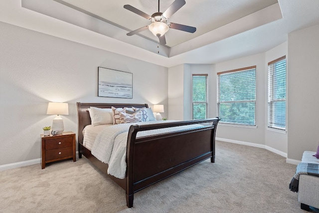 4801 Pyrenees Pass, Bee Cave, TX 78738 - bedroom with carpet flooring, a raised ceiling, and a ceiling fan
