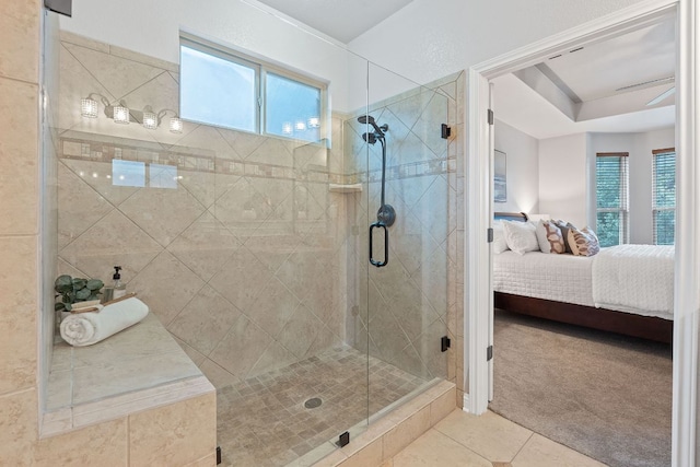 4801 Pyrenees Pass, Bee Cave, TX 78738 - ensuite bathroom with tile patterned floors, a stall shower, and healthy amount of natural light
