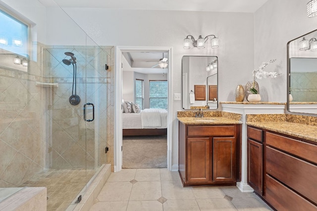 4801 Pyrenees Pass, Bee Cave, TX 78738 - ensuite bathroom with a stall shower, vanity, tile patterned flooring, and ceiling fan