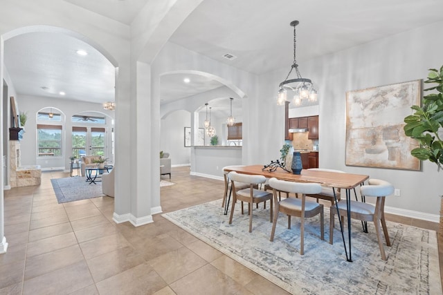 4801 Pyrenees Pass, Bee Cave, TX 78738 - dining room with a chandelier, arched walkways, recessed lighting, and baseboards