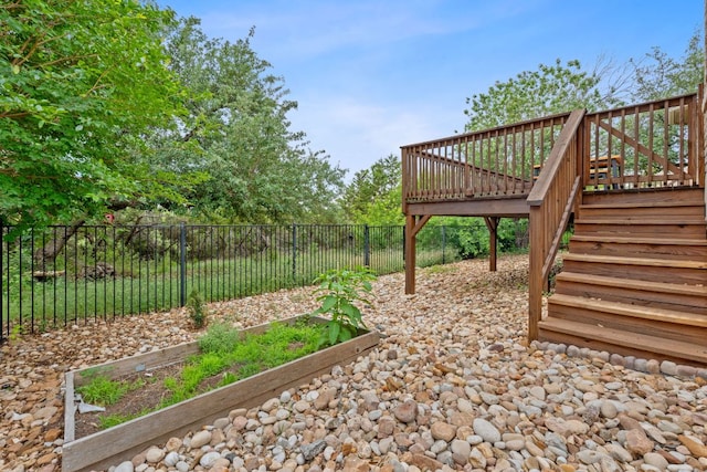 4801 Pyrenees Pass, Bee Cave, TX 78738 - view of yard with a garden, a deck, and stairs