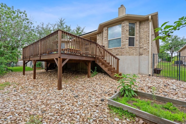4801 Pyrenees Pass, Bee Cave, TX 78738 - rear view of house with stairs, a chimney, and a wooden deck
